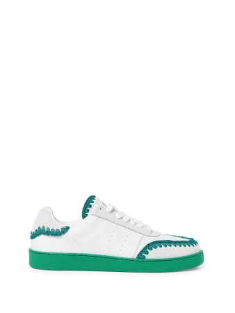 White and green sneaker on a white background in a product shot. The green covers the bottom and accentuates the top of the shoe.