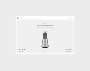 Minimalist e-commerce webpage mockup displaying a conical silver wireless speaker with typography and product pricing on a pale grey background.