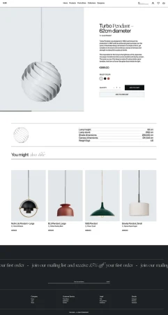A modern white pendant lamp, "Turbo Pendant - 62cm diameter" by Louis Poulsen, hangs in a bright, minimalist product showcase setting.