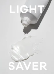 Textured white skincare cream smear on a neutral grey background overlaid with bold white serif typography reading Light Saver.