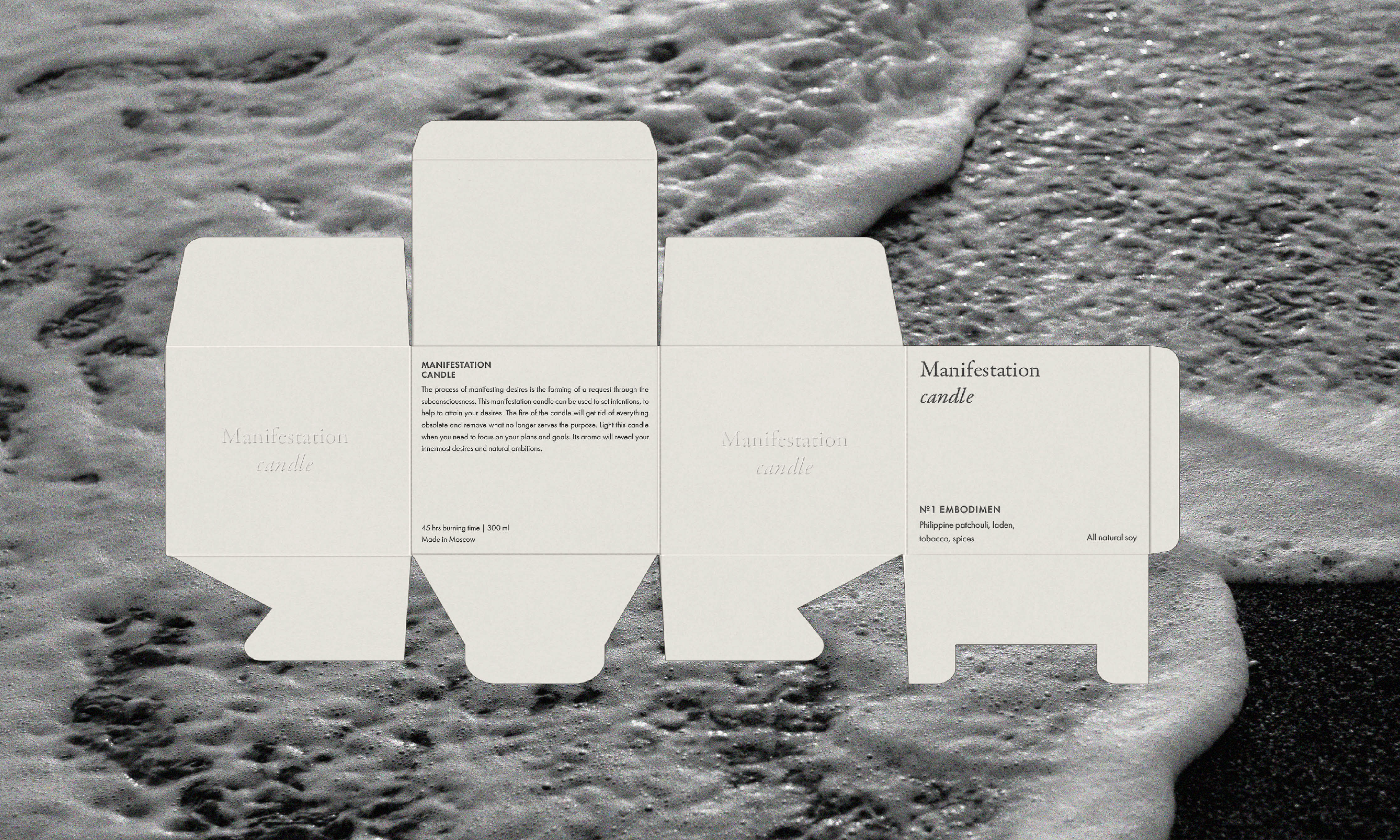 Product shot of a candle box template on a dark sandy beach with ocean waves washing in, monochromatic.