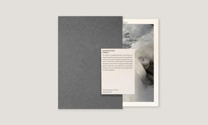 Minimalist Manifestation Candle brand stationery layout with debossed charcoal card, printed card, and sea foam photograph.