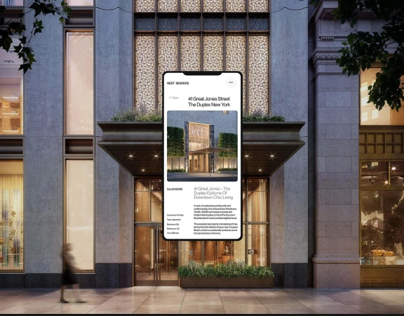 Modern apartment building exterior with large glass windows. A smartphone screen displays the building's listing details.