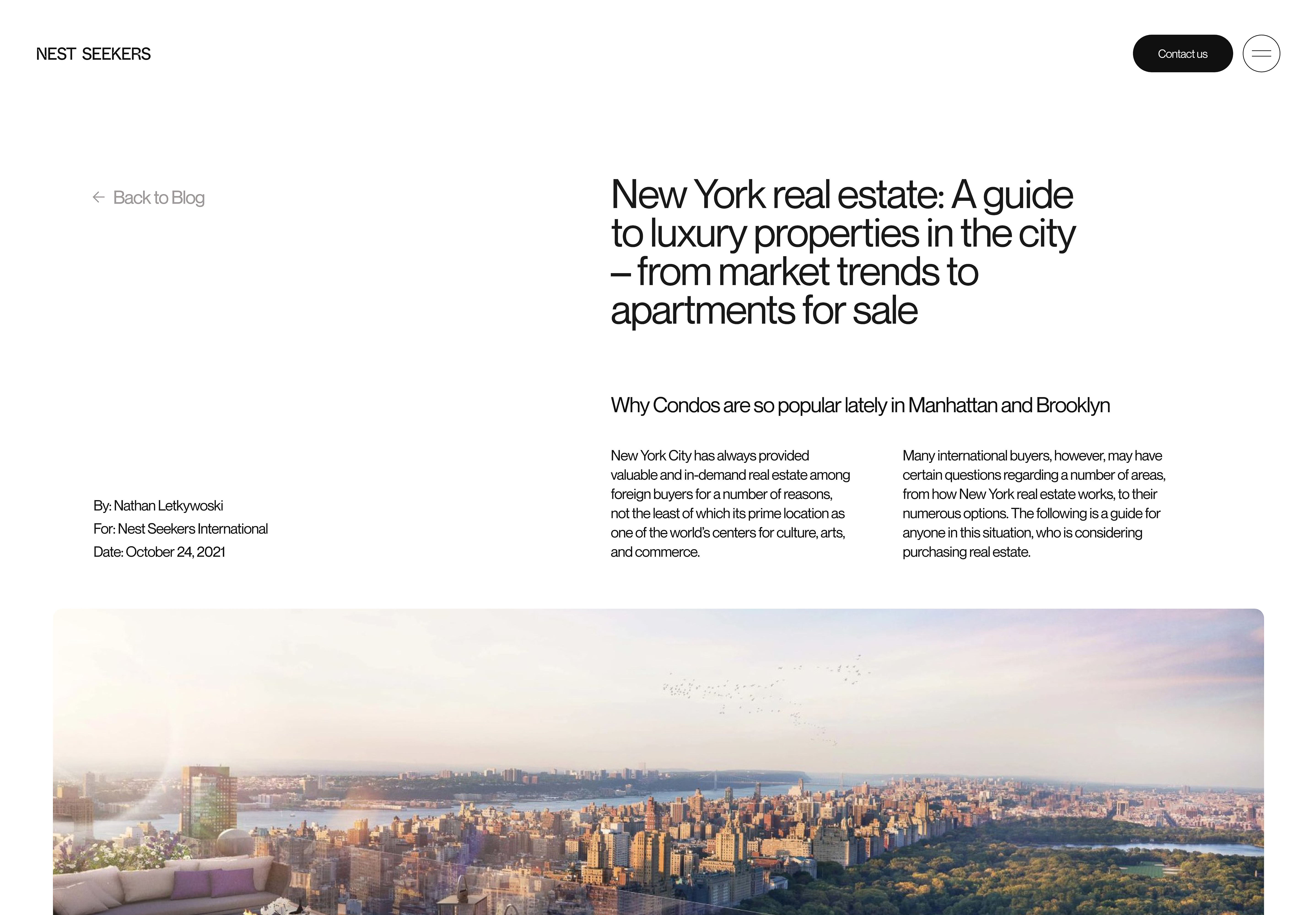 Aerial view of the New York City skyline with Central Park, city buildings, and an outdoor patio with modern furniture.