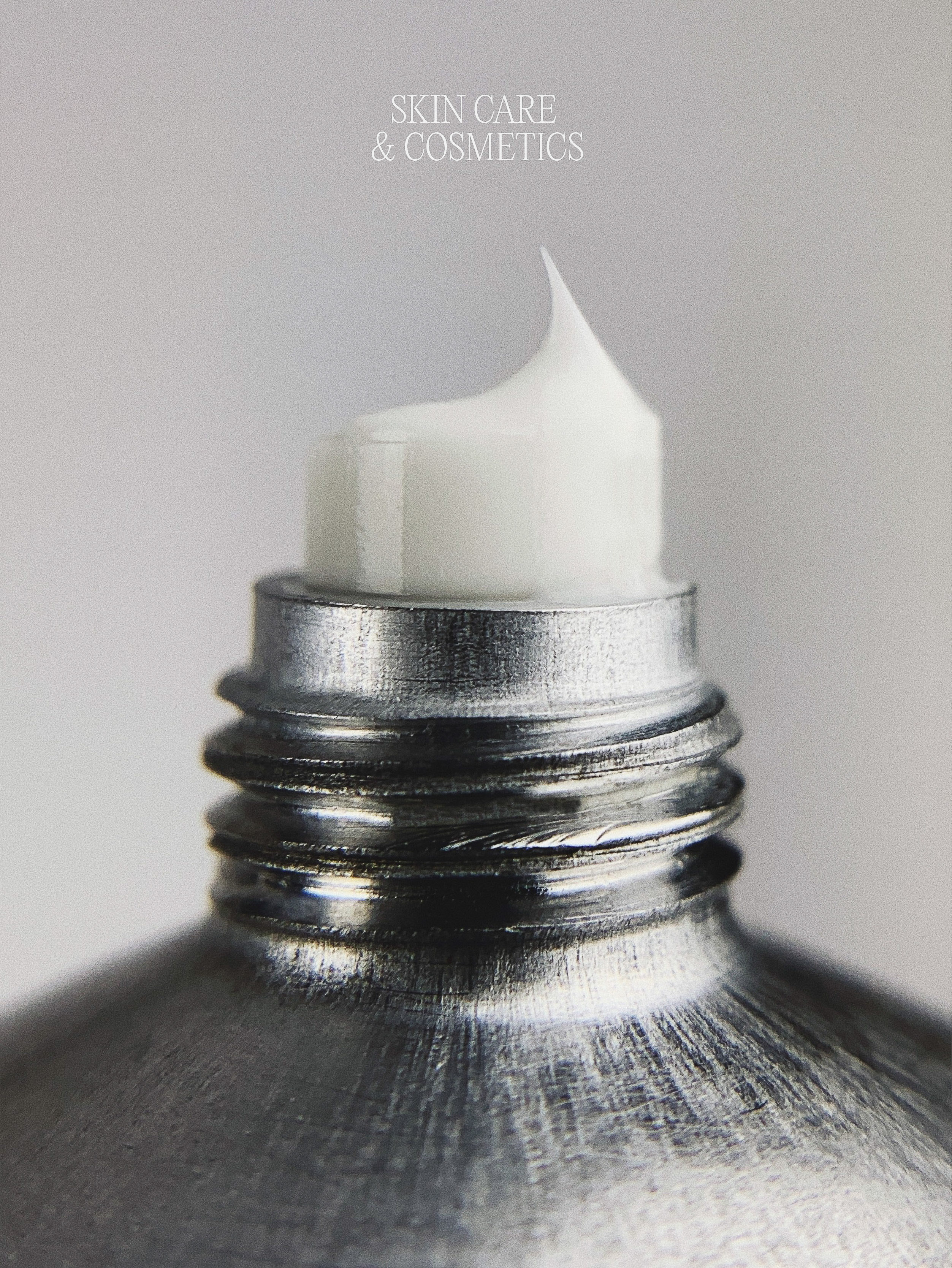 Close-up of a squeezed metal tube of white cream or lotion. Perfect for beauty product advertising, skincare, and cosmetology concepts.