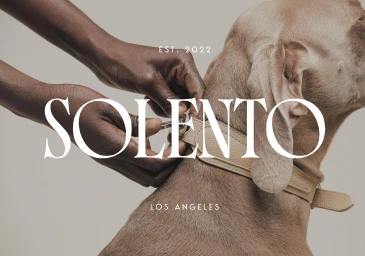 Monochrome image of artisan hands working a manufacturing machine with Solento Los Angeles graphic branding overlaid.