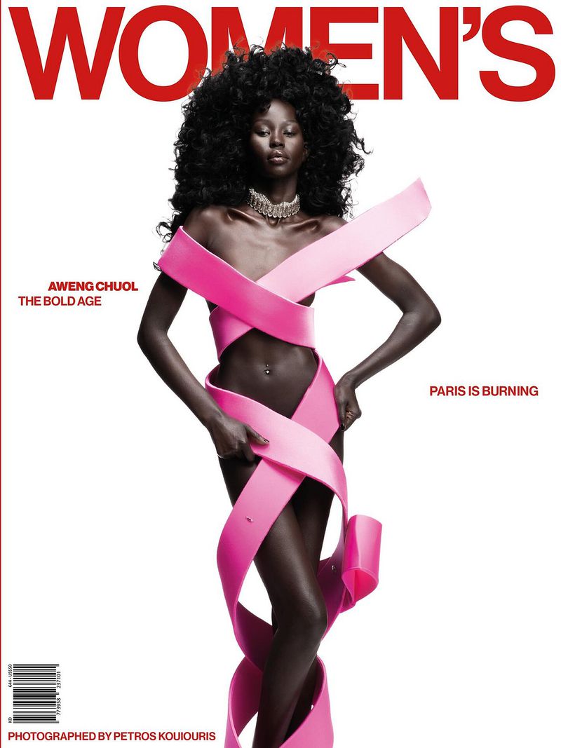Magazine cover featuring a Black fashion model Aweng Chuol, adorned with a pink ribbon-like garment, posing against a clean white backdrop.