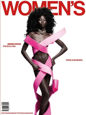 Magazine cover featuring a Black fashion model Aweng Chuol, adorned with a pink ribbon-like garment, posing against a clean white backdrop.