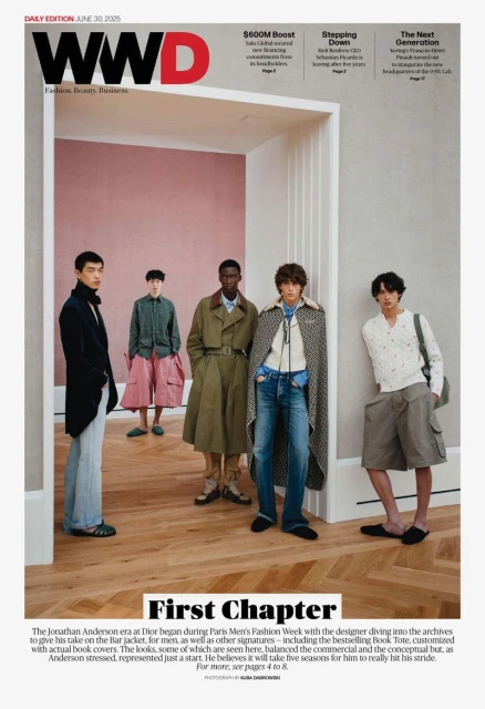 WWD magazine cover featuring a group of male fashion models in a minimalist indoor setting with a white doorway and a wooden floor.