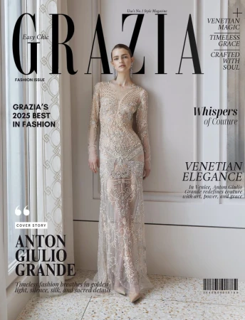 Grazia magazine cover featuring a woman in a sheer, embellished gown, posing against a neutral wall with marble floors and large title text.