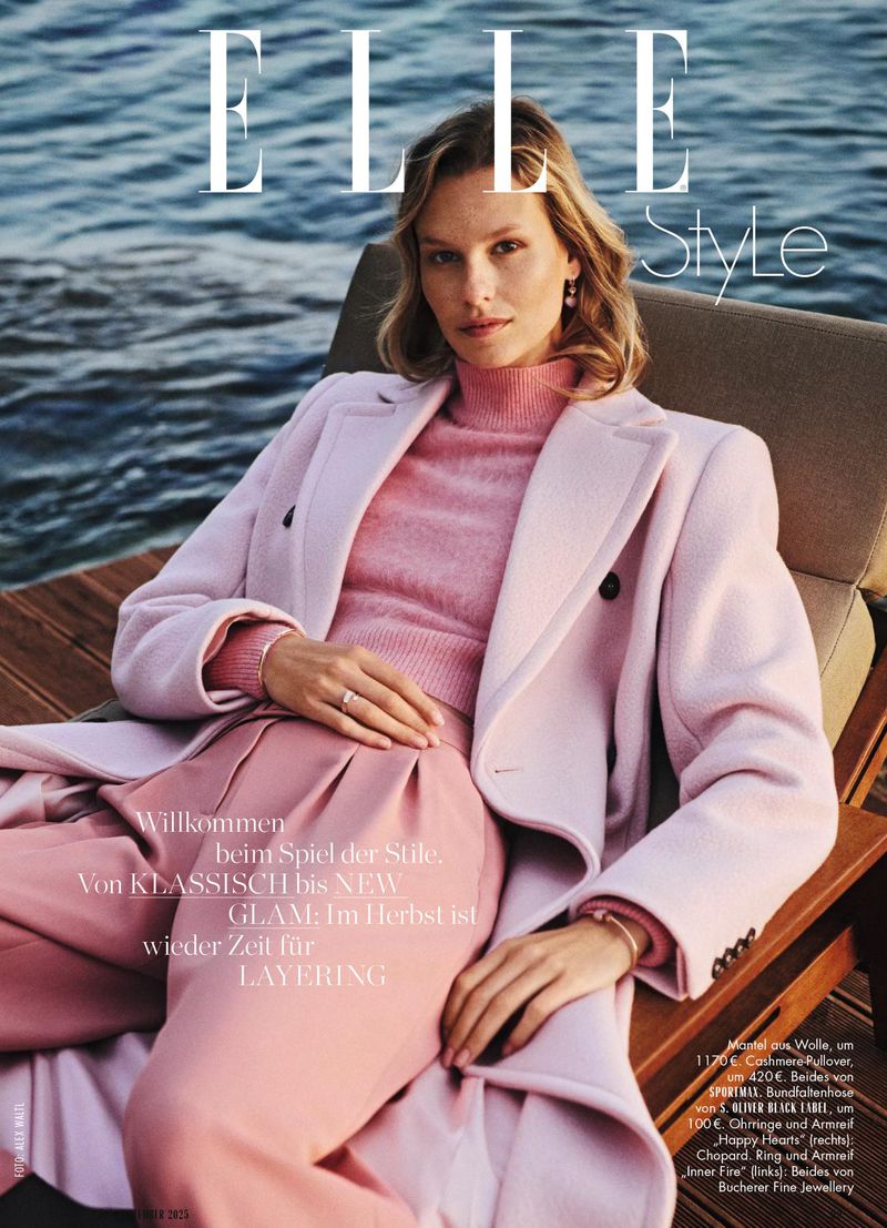 Elle Style magazine cover featuring a blond woman in pink sweater and coat sitting on outdoor furniture by the water.