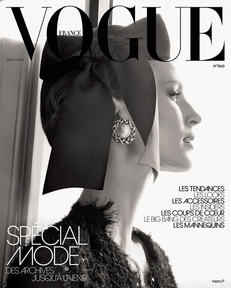 Black and white Vogue France cover featuring a woman with a ribbon headpiece and vintage jewelry, showcasing a blend of fashion and classic elegance.