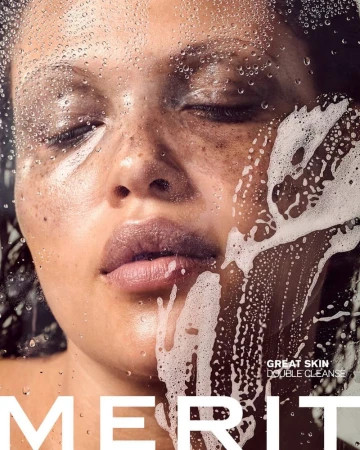 Close-up portrait of a woman with dewy skin, showcasing a clean beauty look, water droplets, and skincare product advertisement.