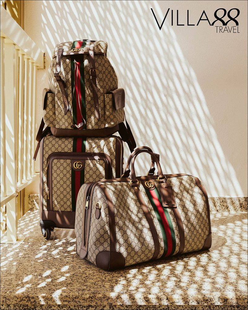 Gucci travel luggage set featuring a backpack, carry-on suitcase, and duffel bag with the brand's signature monogram design.