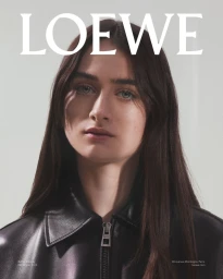 Portrait of Raffey Cassidy wearing a black leather jacket against a white backdrop for Loewe Fall Winter 2025 Campaign