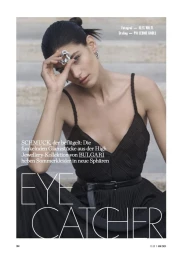 Model Anthi Fakidari wearing a black dress and silver ring posed on outdoor stone steps for Elle Germany.