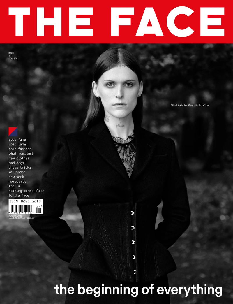 The Face magazine cover featuring a portrait of adult female wearing a black blazer, dark corset and lace top against a dark outdoor background.