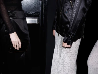 Behind-the-scenes fashion photography of Jason Wu models showcasing black leather jackets and evening wear by Cameron Krone.