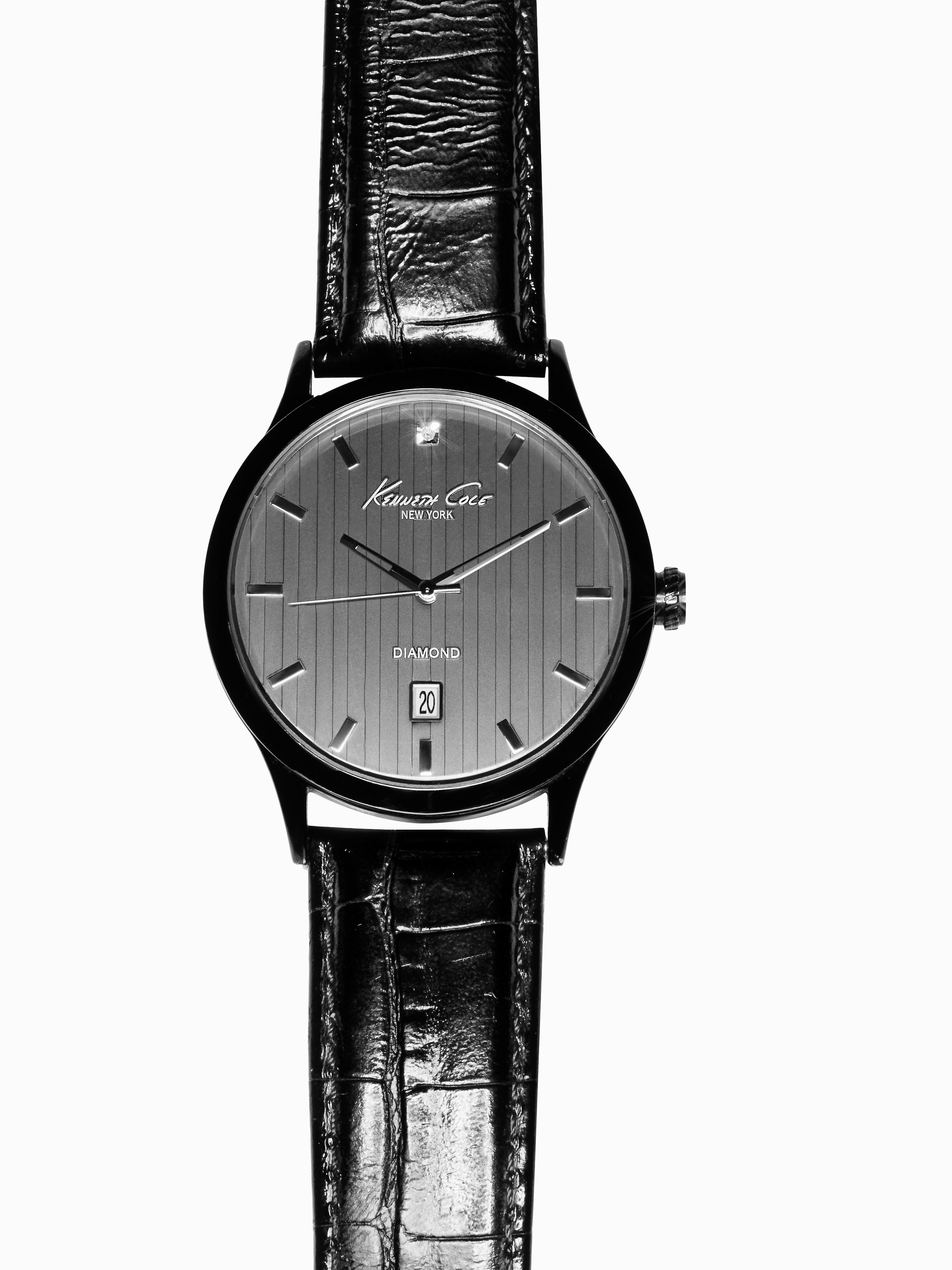 Kenneth Cole wristwatch on a white background. The black leather band complements the sleek black case and gray watch face.