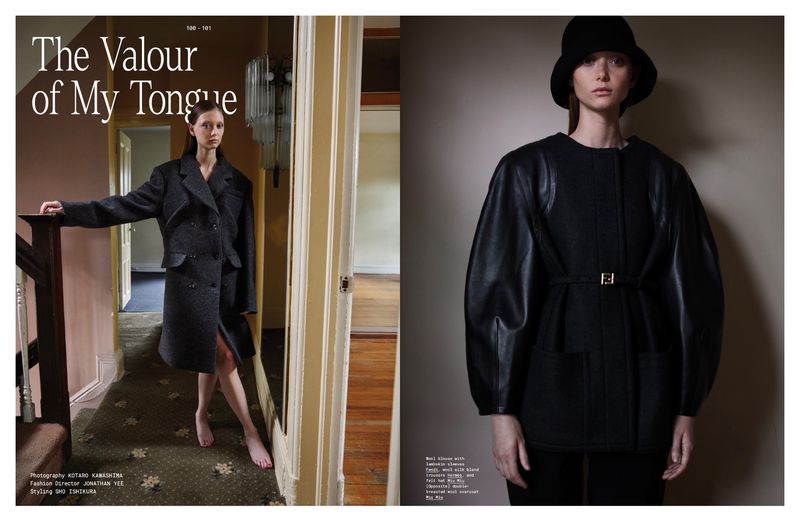 Fashion editorial featuring a woman in a dark coat, captured indoors with soft lighting, showcasing modern, elegant style and design.