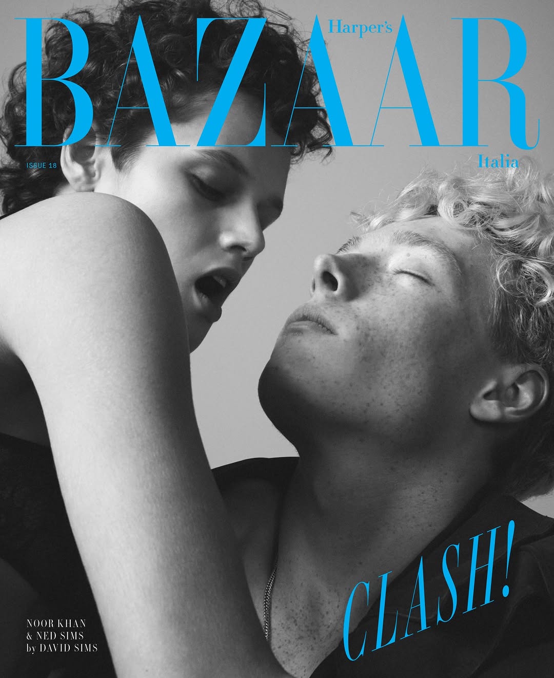 Harper's Bazaar Italia magazine cover featuring two models with close-up shot and striking blue typography.