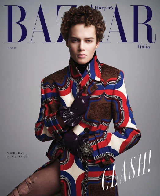 Magazine cover featuring a model in a patterned coat, Harper's Bazaar Italia. Fashion editorial with unique style and bold design elements.