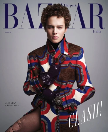 Magazine cover featuring a model in a patterned coat, Harper's Bazaar Italia. Fashion editorial with unique style and bold design elements.
