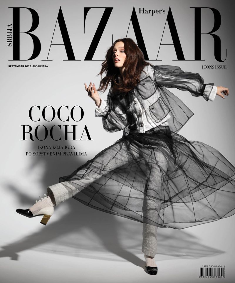 Coco Rocha on the cover of Harper's Bazaar Serbia, September 2020, Icons Issue, wearing a sheer jacket, pants and shoes against a grey background.
