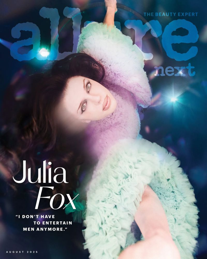 Julia Fox on the cover of Allure magazine next, wearing a ruffled, mint-green dress. The cover has a blue color grade.