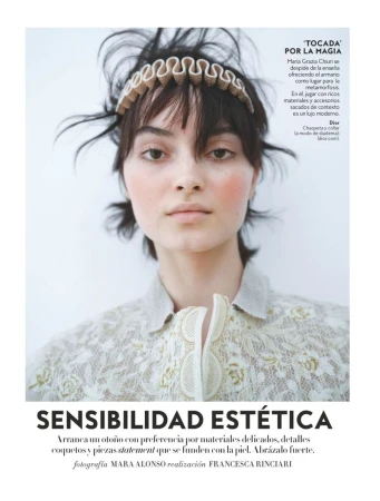 Model Greta Hajwos wearing a ruffled headband and embroidered cream lace top in an editorial portrait for InStyle Spain.