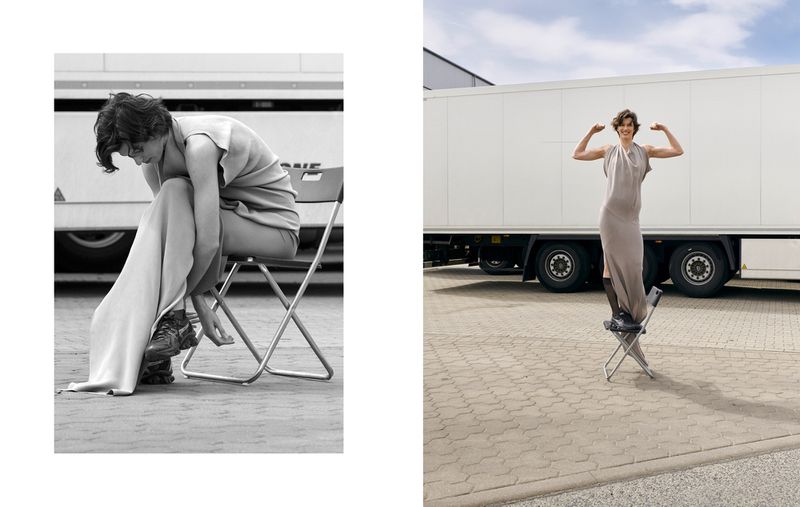 Fashion shot featuring a model in a dress, sitting and standing on a folding chair against a truck, in black and white and colour.