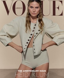 Fashion magazine cover featuring model Heidi Klum in light-beige high-waisted shorts and matching jacket against a neutral backdrop.