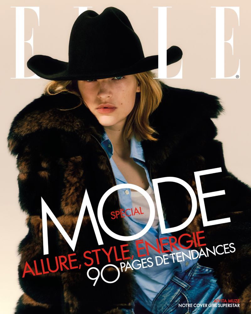 Elle magazine cover featuring a young woman in a black hat and fur coat against a tan background with bold magazine text.
