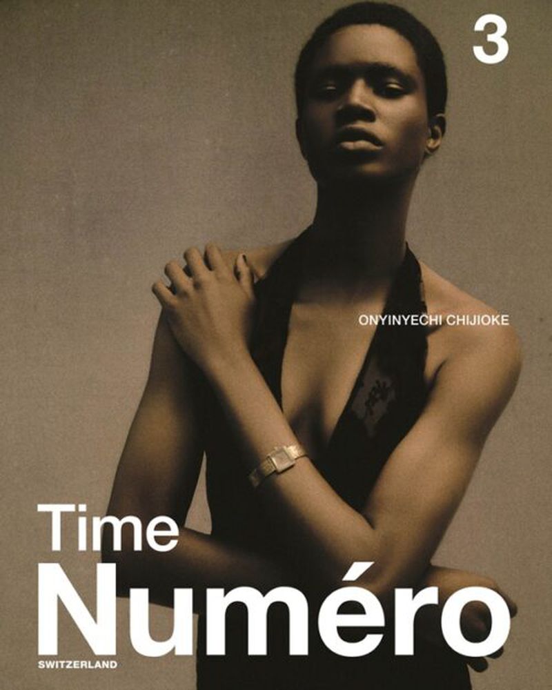 Fashion magazine cover featuring a portrait of a Black woman in a halter top, accessorized with a watch against a neutral backdrop.