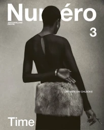 Back view of model Onyinyechi Chijioke in a sheer black top and fur skirt for Numéro Switzerland Digital cover.