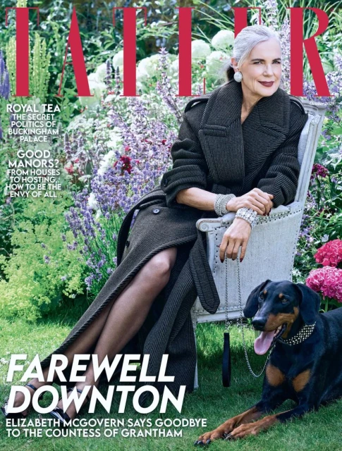 Magazine cover featuring an older woman in a coat sitting outside with her dog, garden flowers in the background. 'Farewell Downton' headline.