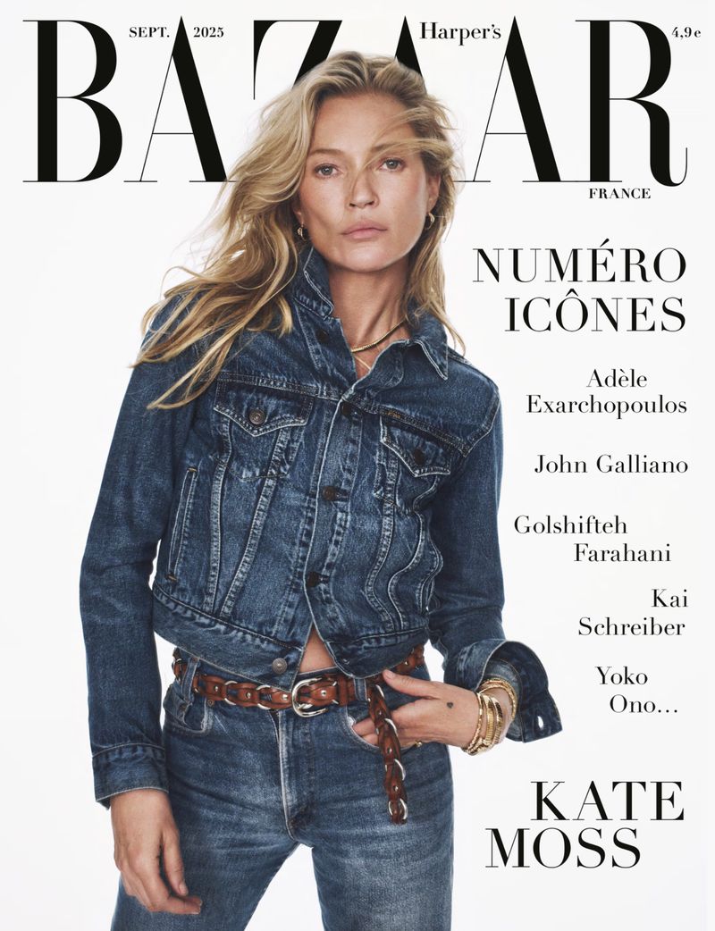 Kate Moss poses on the cover of Harper's Bazaar France, wearing a denim jacket and jeans against a bright, neutral backdrop.