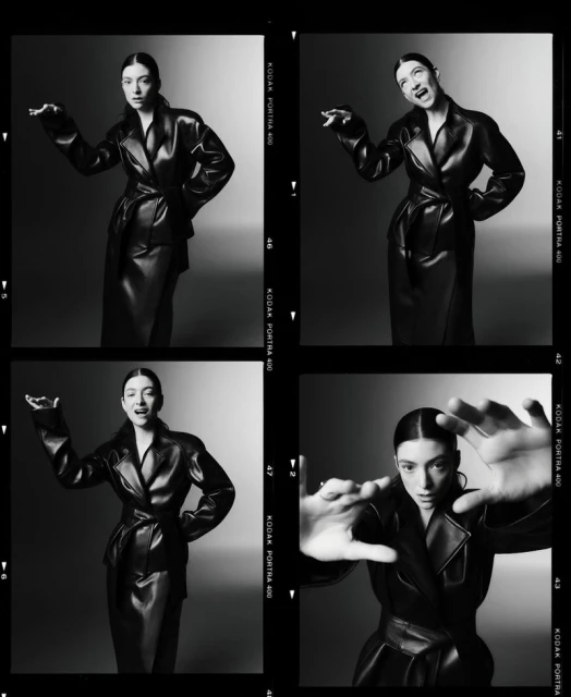 Black and white studio contact sheet featuring a woman in a black leather coat and skirt making exaggerated poses in four frames.