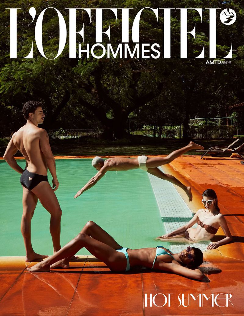 Editorial fashion shot of four swimsuit-clad people by a turquoise pool with orange tiling, against a leafy green background.