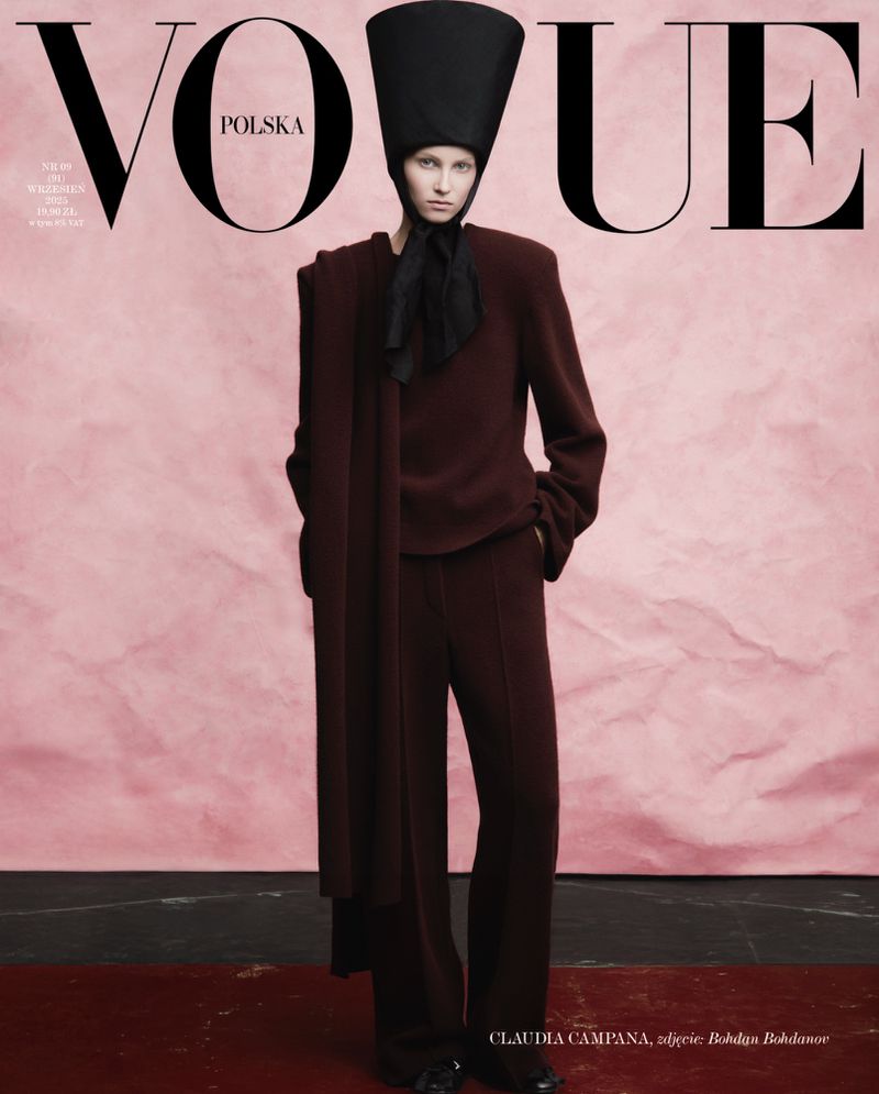Vogue Polska cover featuring a woman in a dark brown outfit and a large hat against a light pink backdrop, fashion editorial photography.