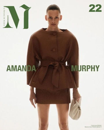 Magazine cover featuring a model in a brown outfit with a matching belt and clutch, set against a bright background and green text.