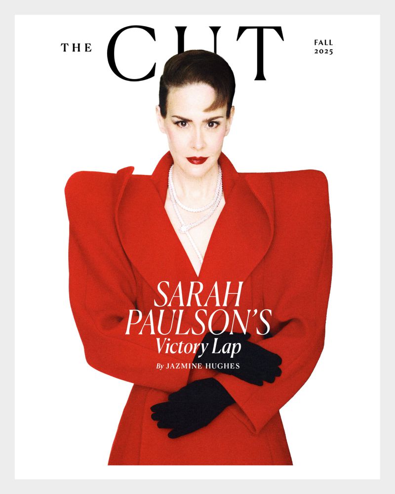 Sarah Paulson on magazine cover in bold red coat, black gloves, and pearl necklace against a white background. Fall 2025.