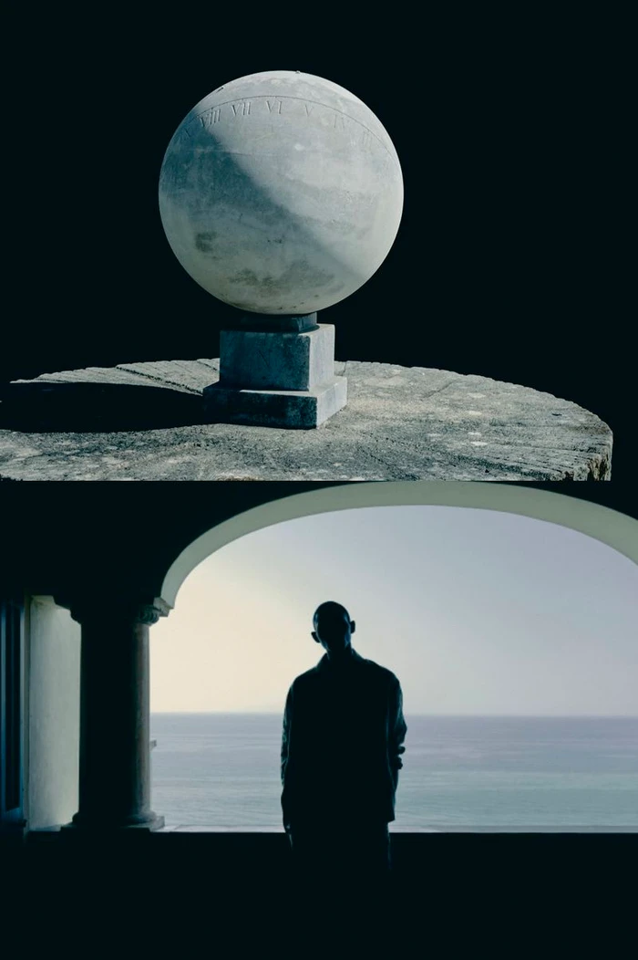 Split composition showing a stone spherical sundial on a plinth above a silhouetted man looking out an arched balcony toward the sea.