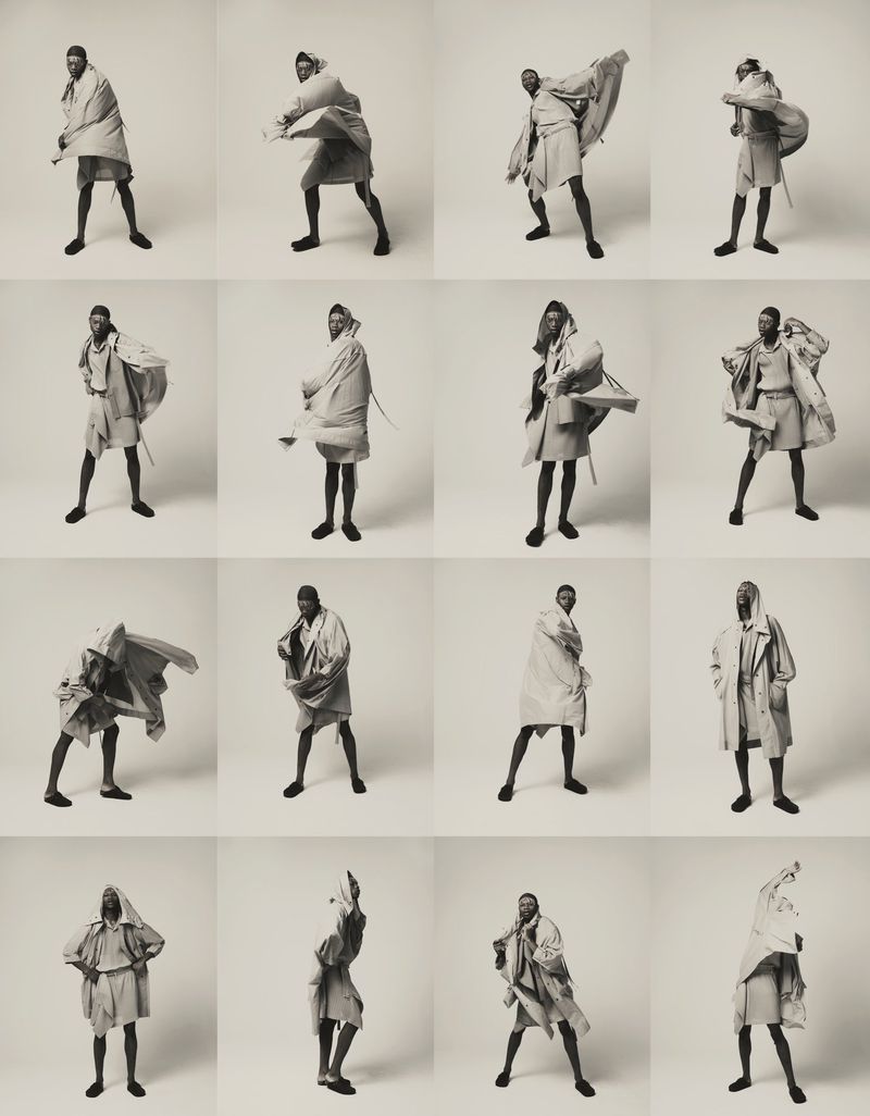 Multiple images show a Black male model in a studio wearing a loose-fitting tan outfit, posing in various positions against a white backdrop.