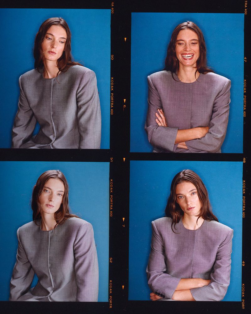 Portrait of a woman in a grey suit jacket against a blue background, displayed in a four-panel contact sheet style.