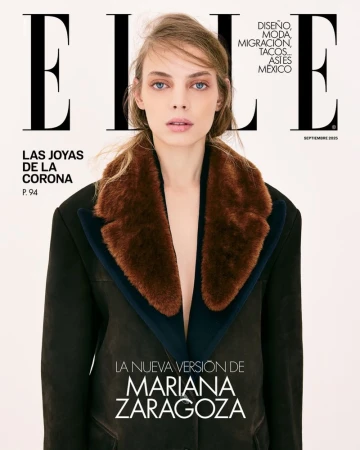 Elle magazine cover featuring a woman with blond hair wearing a black coat with a brown fur collar on a neutral background.