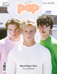 Three young men in cable-knit sweaters in pink, white, and green standing together for Pop Magazine issue 53 cover