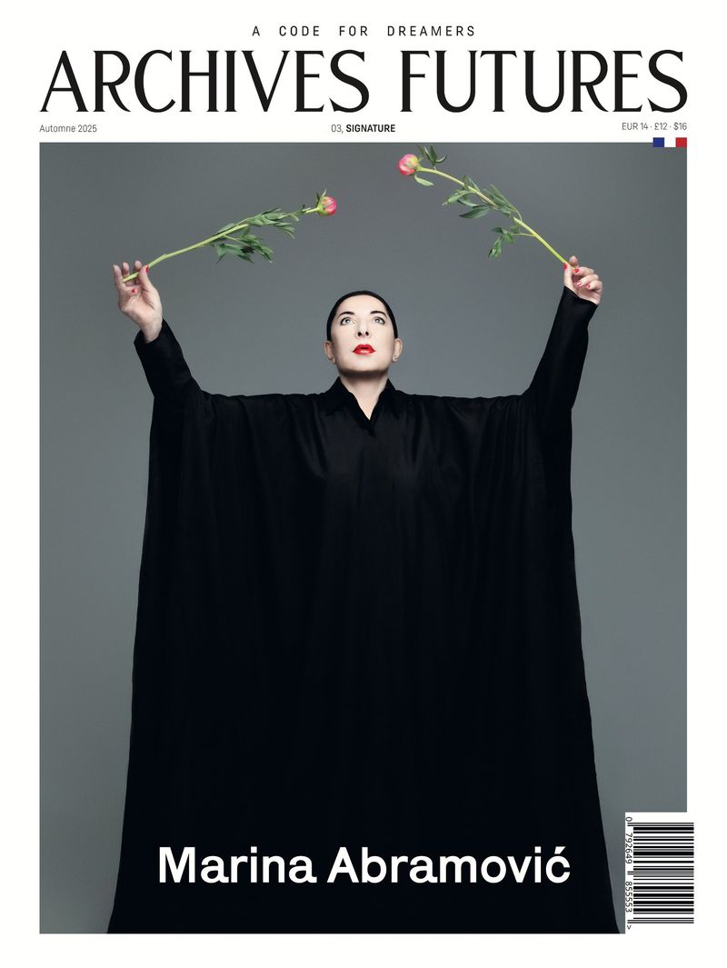 Magazine cover featuring Marina Abramović in black robe holding roses against a grey background, with 'Archives Futures' text.