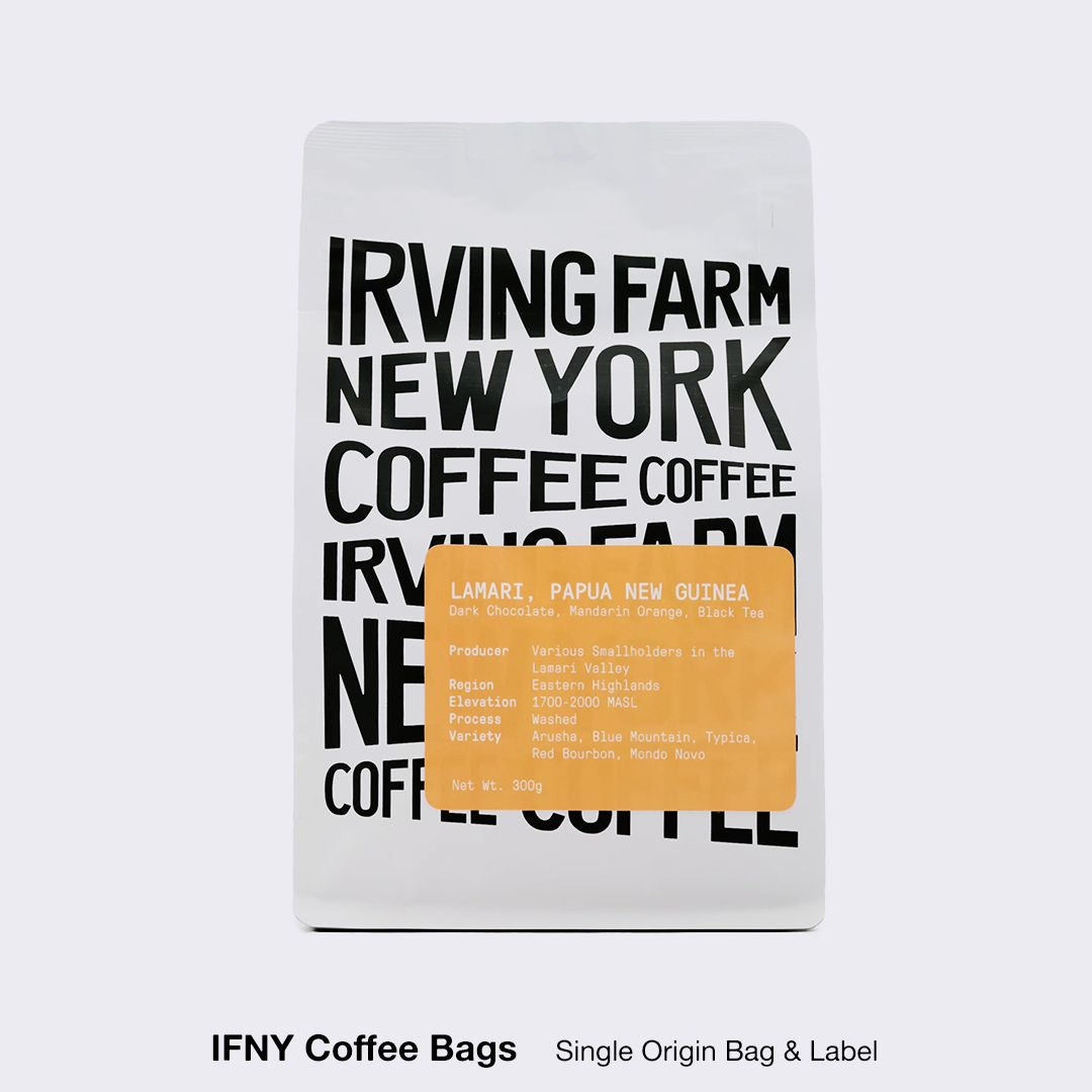 Irving Farm New York coffee bag featuring Lamari Papua New Guinea single-origin coffee with dark chocolate, mandarin orange, and black tea flavor notes.