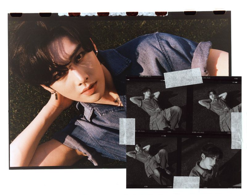 A person with dark hair and a blue denim shirt lies on green grass, looking at the camera. Additional film strip images are included.